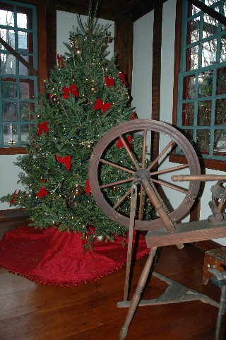 Spinning Wheel and Christmas Tree, alt. view of Living Room decorated for the Holidays